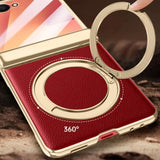 Red phone case with gold ring holder and text about magnetic attraction and rotation.